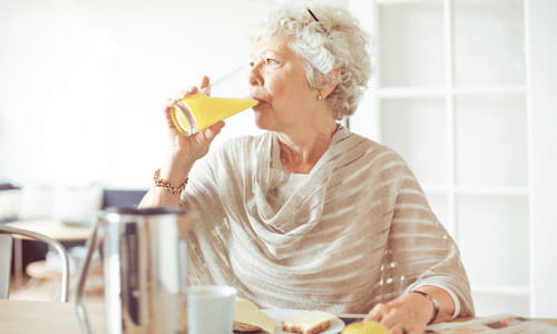 Older Adult Drinking Juice